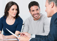 A couple speaking to an expert about conveyancing